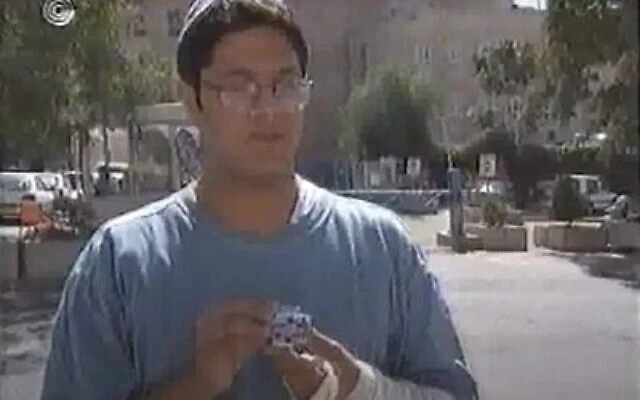 Itamar Ben Gvir seen holding up an ornament from former prime minister Yitzhak Rabin’s car, in an October 1995 interview. (Screen capture: YouTube/IBA)